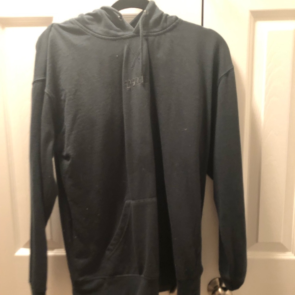 A dark green Vibes hoodie